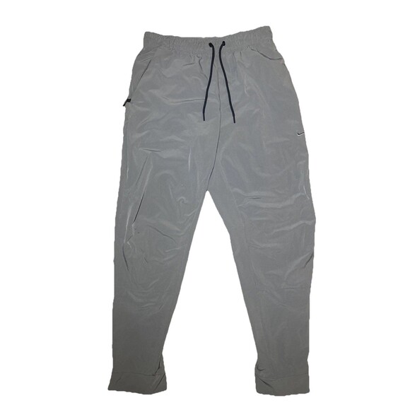 Medium Nike unlimited Men’s Dri-Fit Zip Cuff Versatile Pants Smoke Grey - Picture 1 of 8